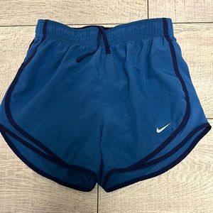 Nike Blue Athletic Shorts with Curved Hem and Elastic Waistband